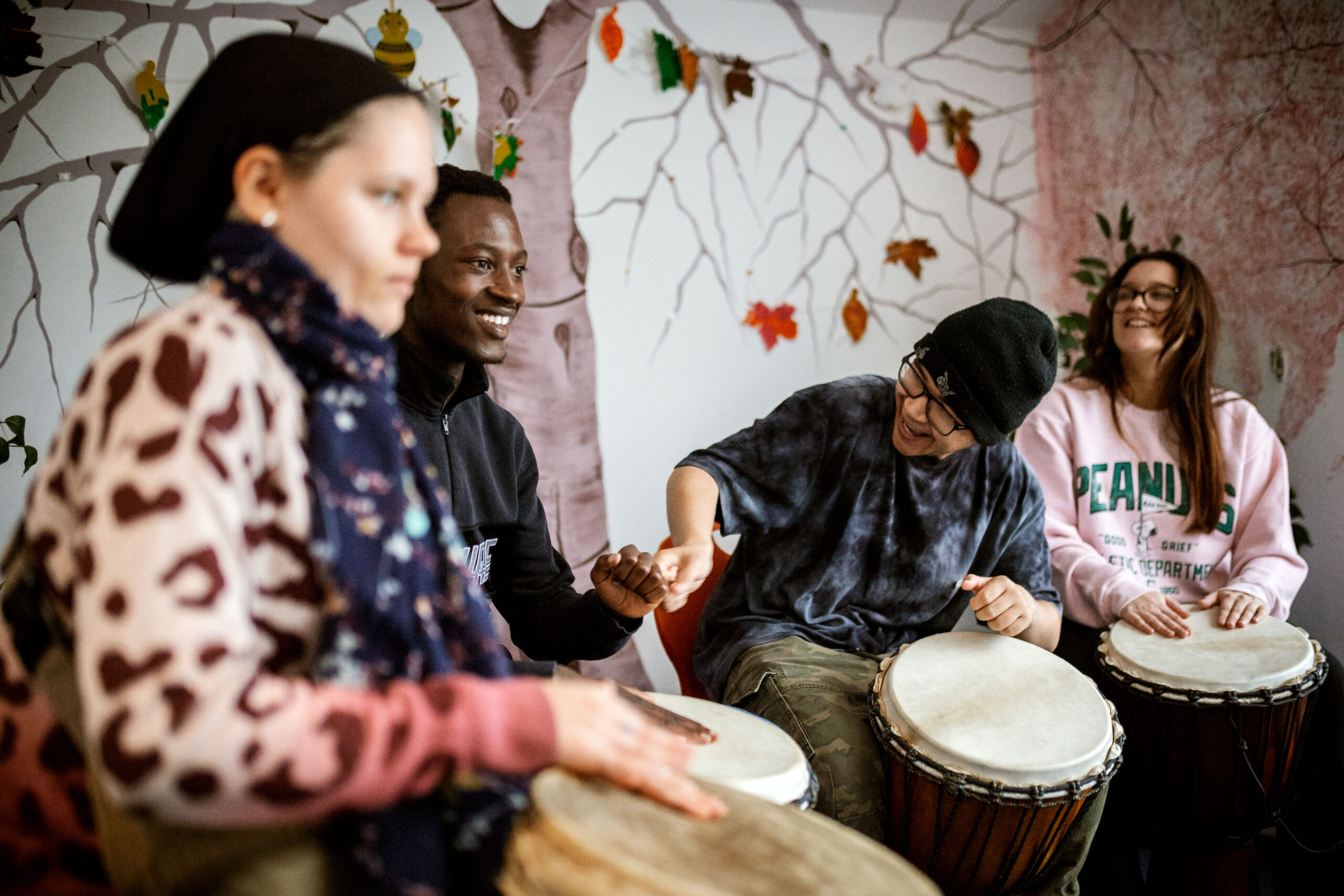 Several people playing drums