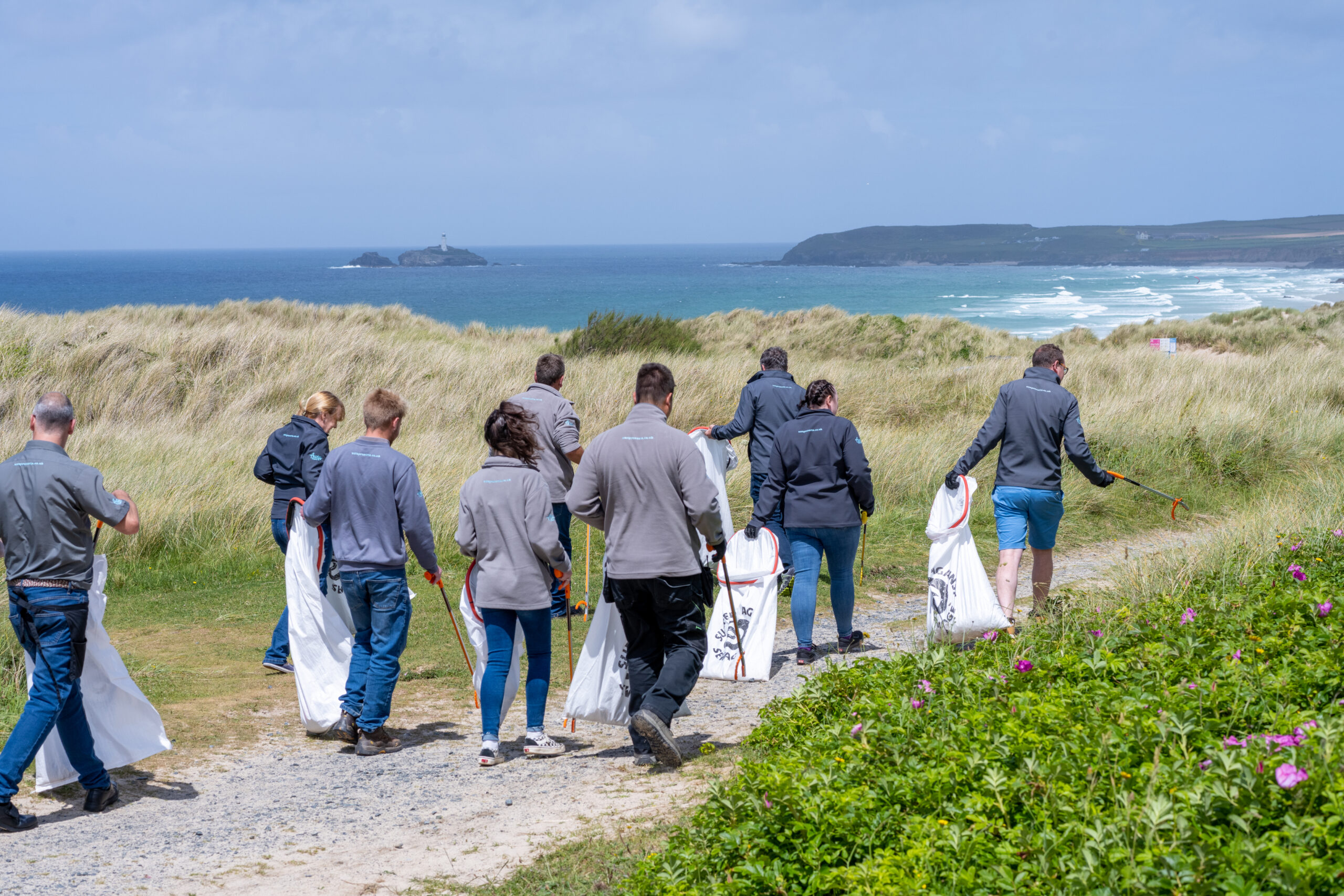 Group of adults beach cleaning
