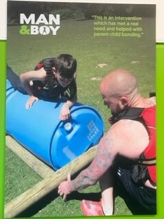 A child and a man building a raft